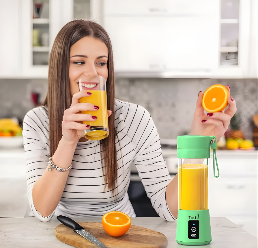 Woman enjoying a smoothie made with a Portable USB Juice Blender in a modern kitchen.